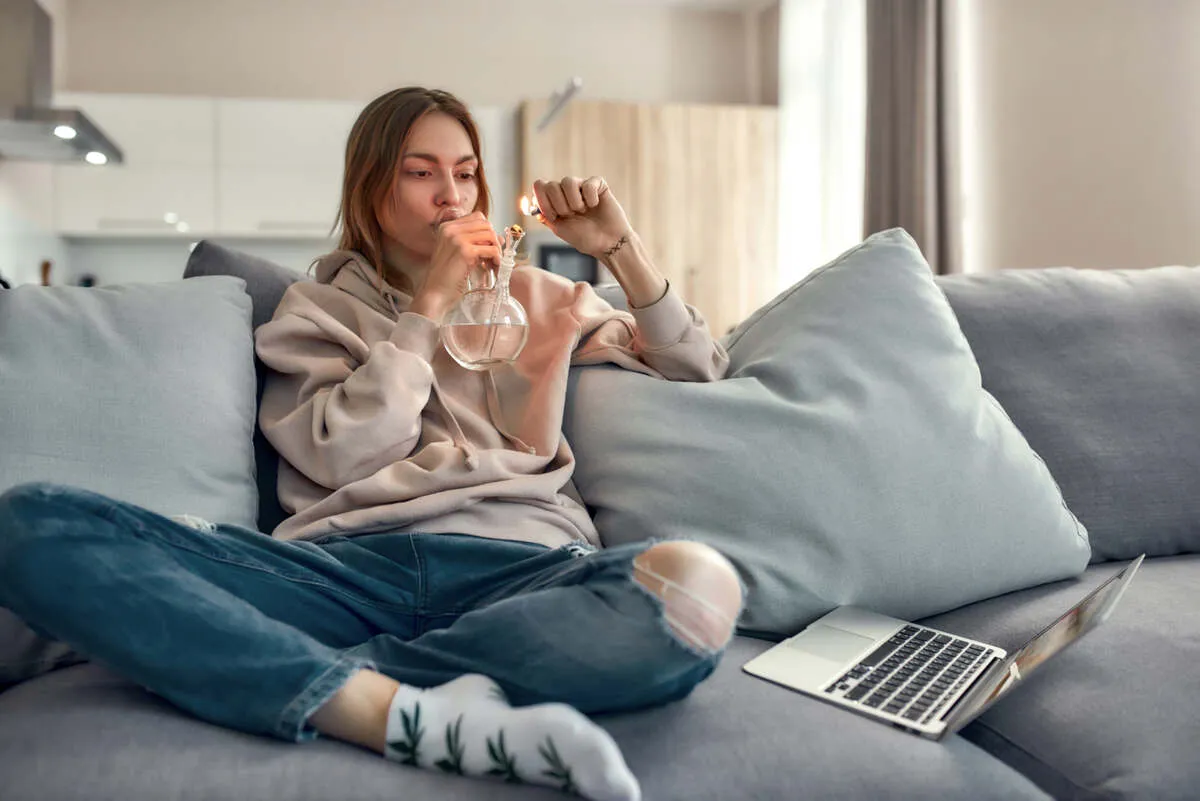 Women smoking cannabis with a bong.